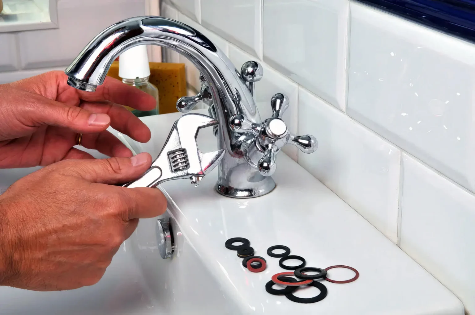 Plumber maintaining a bathroom faucet in San Mateo